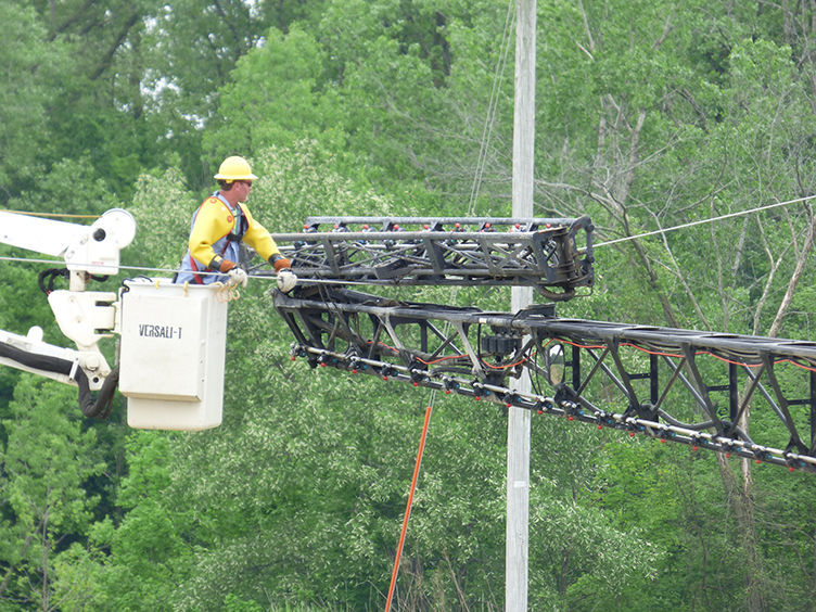 Sprayer gets caught in power lines